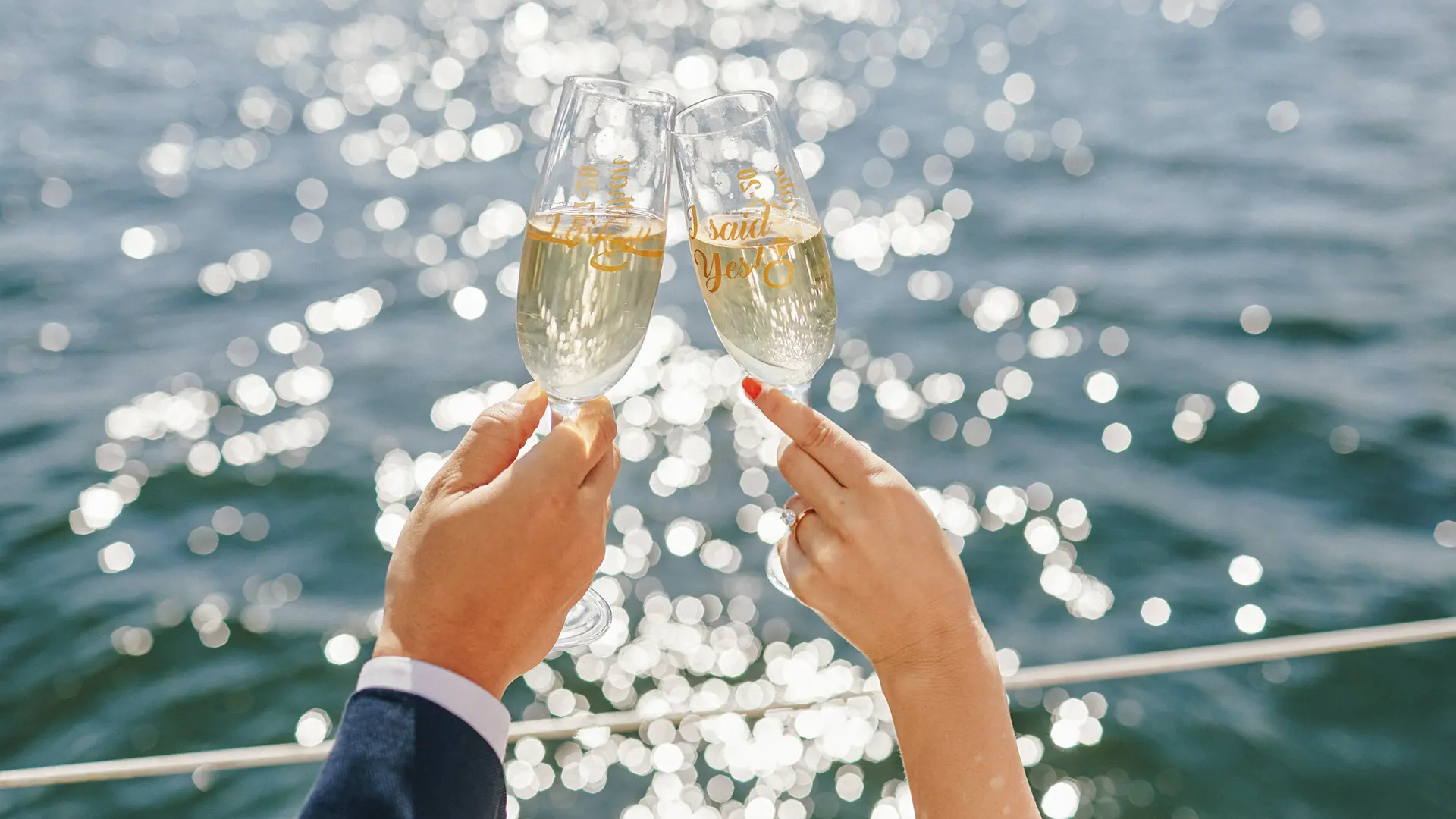 A toast on deck above sunlit water